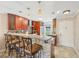 Modern kitchen with granite countertops, updated cabinetry, and breakfast bar at 7200 Ulmerton Rd # E3, Largo, FL 33771