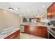 Open concept kitchen with island and view into living area at 7200 Ulmerton Rd # E3, Largo, FL 33771