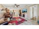 Spacious living area featuring a fireplace and an open floor plan at 7200 Ulmerton Rd # E3, Largo, FL 33771