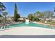 Community pool with lounge chairs at 7200 Ulmerton Rd # E3, Largo, FL 33771