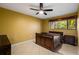 Cozy bedroom with wood framed bed and ceiling fan at 810 S Village N Dr # 201, St Petersburg, FL 33716