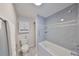 Stylish bathroom featuring a bathtub with blue subway tile and chrome fixtures at 8186 Terrace Garden N Dr # 102, St Petersburg, FL 33709