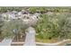 Aerial view of a single-Gathering house, showcasing its driveway and surrounding landscape at 13029 Haverhill Dr, Spring Hill, FL 34609