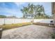 Landscaped backyard with patio and fenced perimeter at 13029 Haverhill Dr, Spring Hill, FL 34609