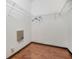 Large walk-in closet with wire shelving and wood floor at 13029 Haverhill Dr, Spring Hill, FL 34609