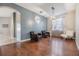 Bright dining room with hardwood floors and stylish light fixture at 13029 Haverhill Dr, Spring Hill, FL 34609
