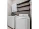 Laundry room with Samsung washer and dryer, cabinets, and shelving at 13029 Haverhill Dr, Spring Hill, FL 34609
