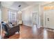 Living room features hardwood floors and access to front entry at 13029 Haverhill Dr, Spring Hill, FL 34609