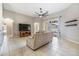 Living room with tile floors, neutral walls, and sliding glass doors at 13029 Haverhill Dr, Spring Hill, FL 34609