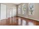 Bright office space with wood floors and large windows at 13029 Haverhill Dr, Spring Hill, FL 34609