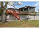 Large backyard with deck, patio, and playground at 1866 Michigan Ne Ave, St Petersburg, FL 33703