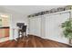 Bedroom with built-in shelving, wood floors, and home office at 1866 Michigan Ne Ave, St Petersburg, FL 33703