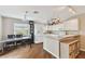 Eat-in kitchen with white cabinets, granite countertop, and island at 1866 Michigan Ne Ave, St Petersburg, FL 33703
