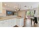 Bright kitchen with white cabinets, wood floors, and a breakfast bar at 1866 Michigan Ne Ave, St Petersburg, FL 33703