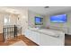 Loft area with sectional sofa, large TV, and hardwood floors at 1866 Michigan Ne Ave, St Petersburg, FL 33703