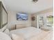 Main bedroom with king-size bed and access to deck at 1866 Michigan Ne Ave, St Petersburg, FL 33703
