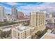 Aerial view of a luxury apartment building with city skyline and nearby amenities at 275 Bayshore Blvd # 408, Tampa, FL 33606