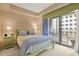 Charming bedroom with light green furniture and access to a balcony at 275 Bayshore Blvd # 408, Tampa, FL 33606