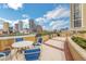Rooftop patio with seating and grills offering city views at 275 Bayshore Blvd # 408, Tampa, FL 33606