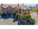 Aerial view of waterfront condo building with parking and palm trees at 2773 Via Cipriani # 1321B, Clearwater, FL 33764
