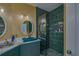Modern bathroom with teal sink and a walk-in shower at 2773 Via Cipriani # 1321B, Clearwater, FL 33764