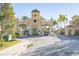 Gated community entrance with a grand, ornate archway and clock tower at 2773 Via Cipriani # 1321B, Clearwater, FL 33764