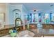 Kitchen sink and granite countertop with view into living room at 2773 Via Cipriani # 1321B, Clearwater, FL 33764