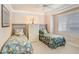 Bedroom with twin beds, built-in storage, and window at 2867 Grey Oaks Blvd, Tarpon Springs, FL 34688