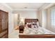 Bedroom with a double bed, nightstand, and window at 2867 Grey Oaks Blvd, Tarpon Springs, FL 34688