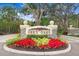 Grey Oaks entrance sign with landscaping and a paved driveway at 2867 Grey Oaks Blvd, Tarpon Springs, FL 34688