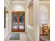 Bright and spacious foyer with elegant double doors at 2867 Grey Oaks Blvd, Tarpon Springs, FL 34688