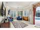 Bright Gathering room with pool view, comfortable seating, and large TV at 2867 Grey Oaks Blvd, Tarpon Springs, FL 34688