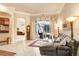 Relaxing Gathering room with leather sectional sofa and access to the pool area at 2867 Grey Oaks Blvd, Tarpon Springs, FL 34688