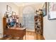 Bright home office with hardwood floors and built-in shelving at 2867 Grey Oaks Blvd, Tarpon Springs, FL 34688