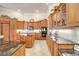 Gourmet kitchen features granite counters, ample cabinetry, and an island at 2867 Grey Oaks Blvd, Tarpon Springs, FL 34688