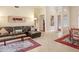 Spacious living room featuring a sectional sofa and area rug at 2867 Grey Oaks Blvd, Tarpon Springs, FL 34688