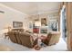 Relaxing living room with fireplace and access to outdoor space at 2867 Grey Oaks Blvd, Tarpon Springs, FL 34688