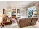 Spacious living room with fireplace and access to pool area at 2867 Grey Oaks Blvd, Tarpon Springs, FL 34688
