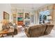 Relaxing living room with fireplace and access to outdoor space at 2867 Grey Oaks Blvd, Tarpon Springs, FL 34688