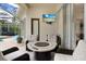 Relaxing pool area with patio furniture and fire pit at 2867 Grey Oaks Blvd, Tarpon Springs, FL 34688