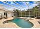 Covered patio area with pool, spa, and comfortable seating at 2867 Grey Oaks Blvd, Tarpon Springs, FL 34688