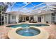 Large pool and spa with covered patio and plenty of seating at 2867 Grey Oaks Blvd, Tarpon Springs, FL 34688