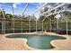 Inviting kidney-shaped pool with a spa and fountain feature at 2867 Grey Oaks Blvd, Tarpon Springs, FL 34688