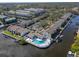 Aerial view showcasing the community's layout, pool, and waterfront access at 314 Moorings Cove Dr, Tarpon Springs, FL 34689