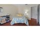 Guest bedroom with floral bedding, and a printer station at 314 Moorings Cove Dr, Tarpon Springs, FL 34689