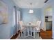 Dining room with light walls, wood floors, and table for four at 314 Moorings Cove Dr, Tarpon Springs, FL 34689
