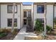 Condo building entry with stairs leading to the unit's entrance at 314 Moorings Cove Dr, Tarpon Springs, FL 34689