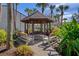 Relaxing gazebo with benches, ideal for outdoor gatherings at 314 Moorings Cove Dr, Tarpon Springs, FL 34689