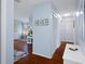 Hallway with light blue walls and wood flooring at 314 Moorings Cove Dr, Tarpon Springs, FL 34689