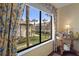 Water view from bedroom window, showcasing palm trees and waterfront at 314 Moorings Cove Dr, Tarpon Springs, FL 34689